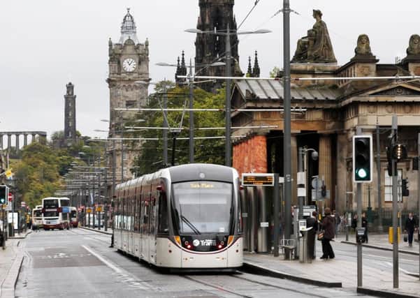 The eight-mile tram line runs between the airport and York Place via Princes Street. The delays to its construction and total cost are now being investigated. Picture: PA
