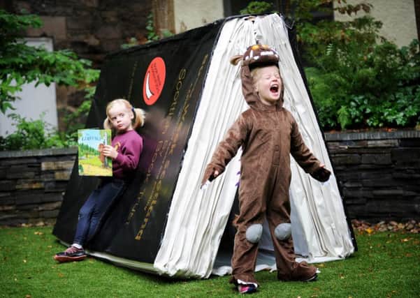 Twins Nora and Emily Patron Birch, four, pick The Gruffalo. Picture: Jane Barlow