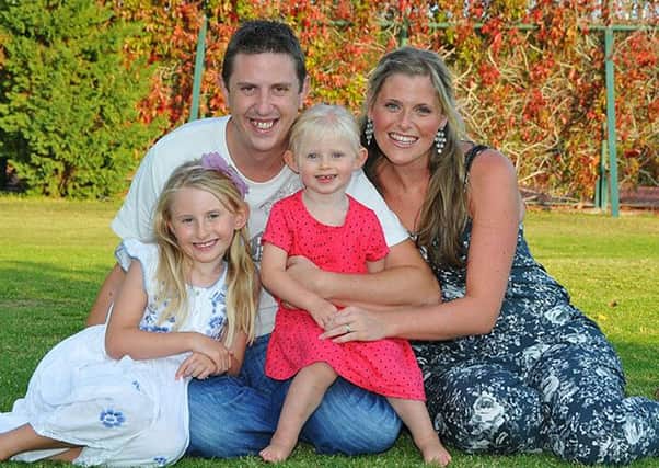 David Phillips with wife Jen and daughters Abigail, 7, and Sophie, 3. Picture: comp