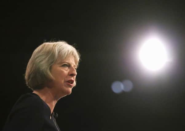 Theresa May delivers her keynote speech to delegates at the Conservative Party Conference in Manchester yesterday. Picture: Getty Images