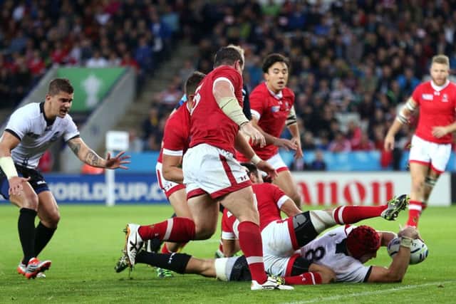 Romania's Mihai Macovei scores a try during the World Cup match against Canada at Leicester City Stadium. Picture: PA