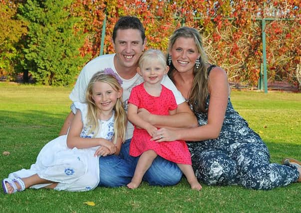 Pc David Phillips with wife Jen and daughters Abigail, 7, and Sophie, 3. Picture: comp