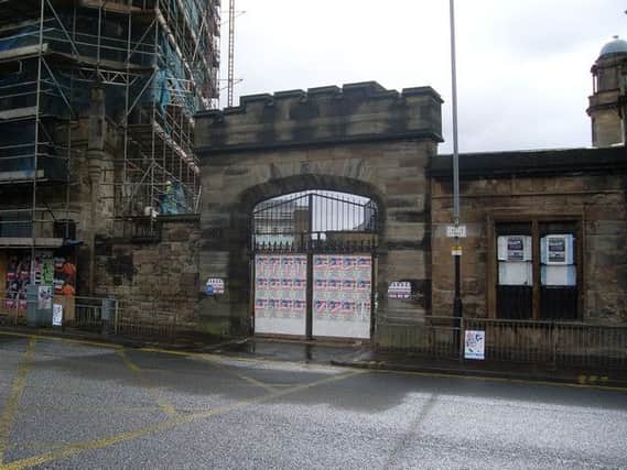 The reconstructed Castle Gate at the entrance to Glasgow Royal Infirmary, a visual reminder the site was once occupied by the Bishop's Castle. Picture: Stephen Simmons
