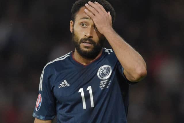 Scotland's Ikechi Anya will miss the Poland match with a calf injury. Picture: SNS