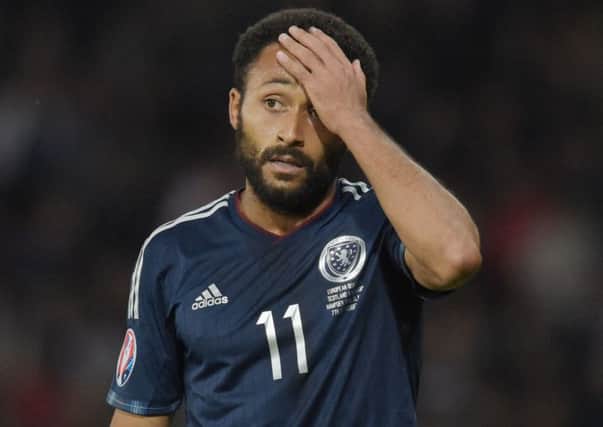 Scotland's Ikechi Anya will miss the Poland match with a calf injury.   Picture: SNS