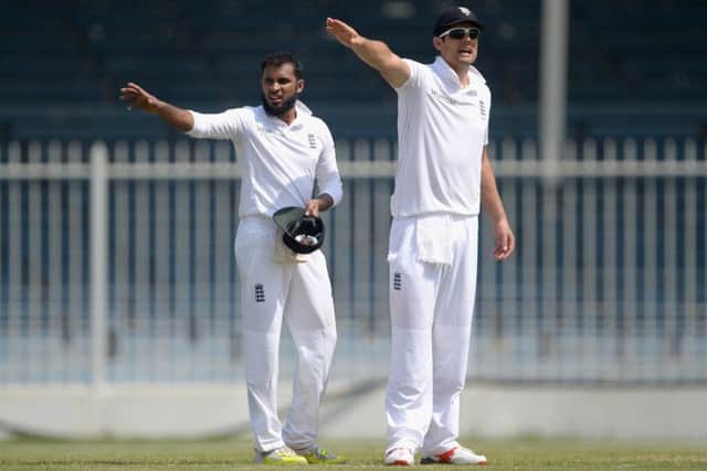 Captain Alastair Cook, right, and Adil Rashid in a warm-up match against Pakistan A. Picture: Getty