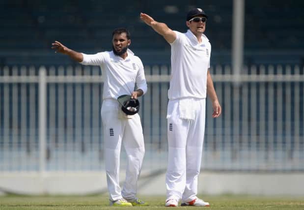 Captain Alastair Cook, right, and Adil Rashid in a warm-up match against Pakistan A. Picture: Getty