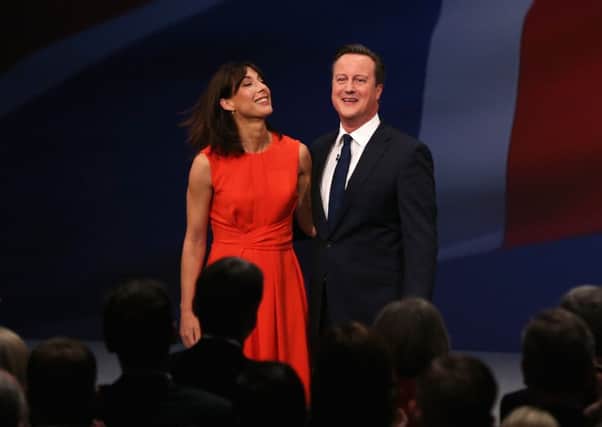David Cameron with wife Samantha received an enthusiastic reception at Tory conference in Manchester yesterday. Picture: Getty