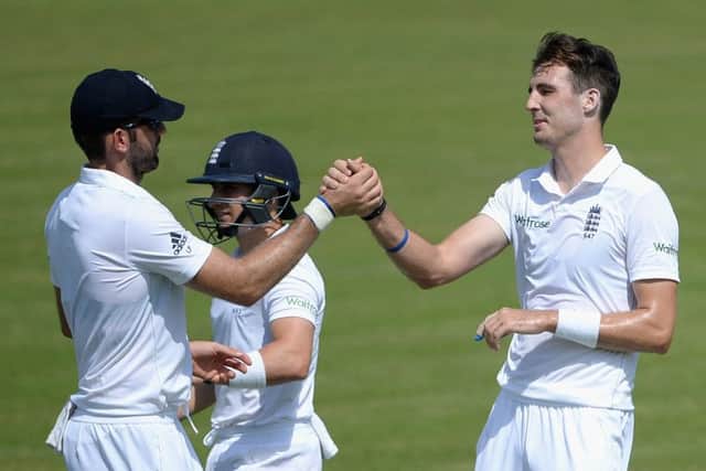 Steven Finn, right, celebrates with Liam Plunkett after dismissing Pakistan As Ali Asad. Picture: Getty