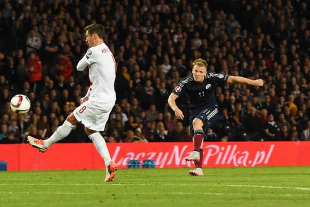 Scotland's Matt Ritchie (right) scores a stunning goal to equalise. Picture: SNS