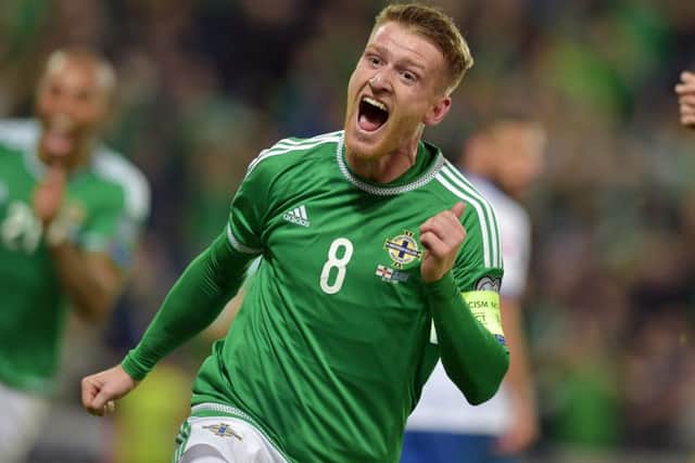 Northern Ireland captain Steven Davis celebrates after scoring his second and his sides third goal against Greece at Windsor Park. Picture: Getty