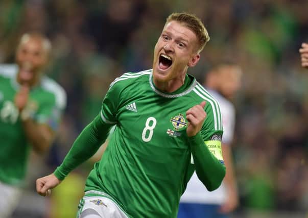 Northern Ireland captain Steven Davis celebrates after scoring his second and his sides third goal against Greece at Windsor Park. Picture: Getty
