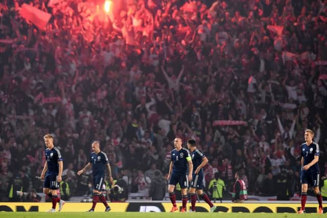 Dejection for the Scotland players. Picture: SNS