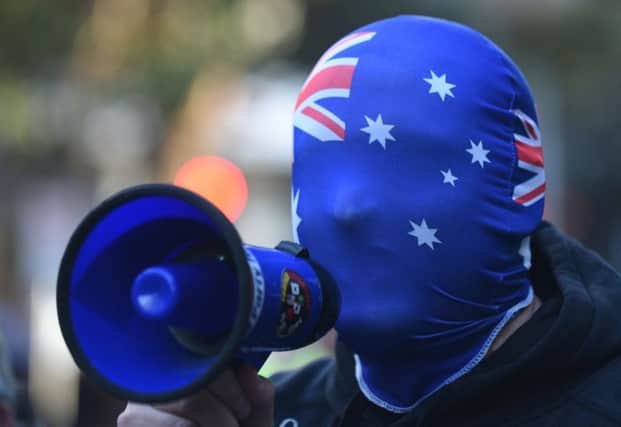 An anti-Muslim protester shouts slogans outside the Parramatta Mosque in Sydney. Picture: Getty