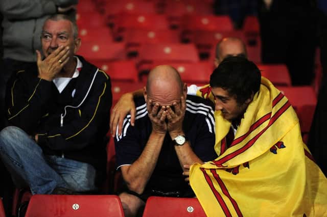 Scotland fans react after last night's draw against Poland. Picture: Michael Gillen