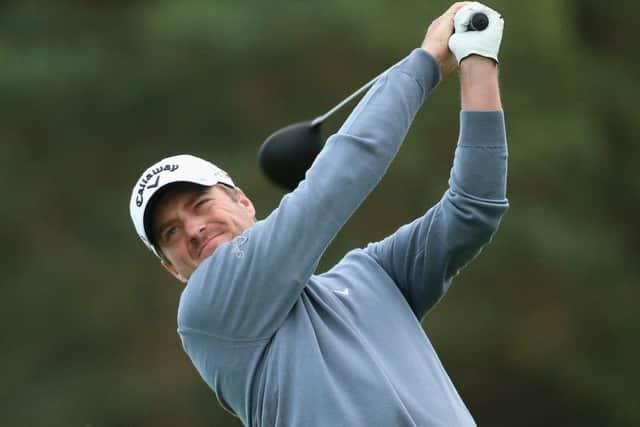 Scotlands Marc Warren hits his tee shot at the 15th during his second round at the British Masters yesterday. Picture: Getty