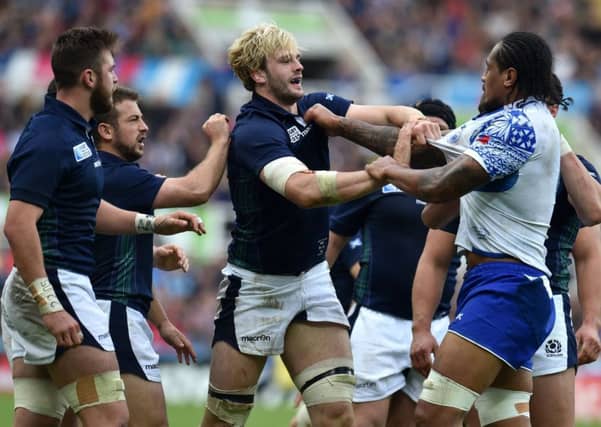 Scotland's Richie Gray (centre) and Samoa's Filo Paulo (right) clash as tempers flare. Picture: PA