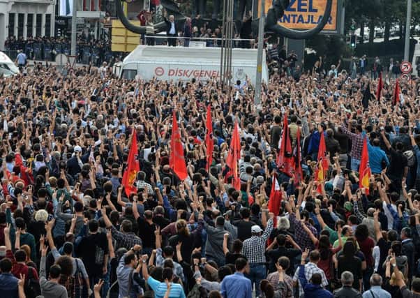 Mourners and protesters gather in an Ankara square after police stopped them going to the scene of Saturdays suicide attacks. Picture: Getty Images