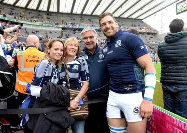 Scotland's Sean Lamont (right) celebrates at full-time with his family in Newcastle. Picture: SNS Group