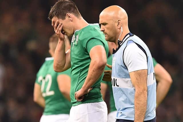 Injured stand-off Jonny Sexton is helped from the field. Picture: AFP/Getty Images