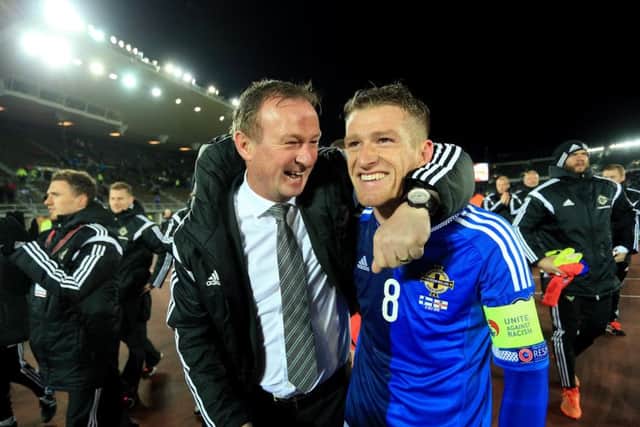 Northern Ireland boss Michael ONeill and captain Steven Davis cant hide their delight at full-time. Picture: Getty Images