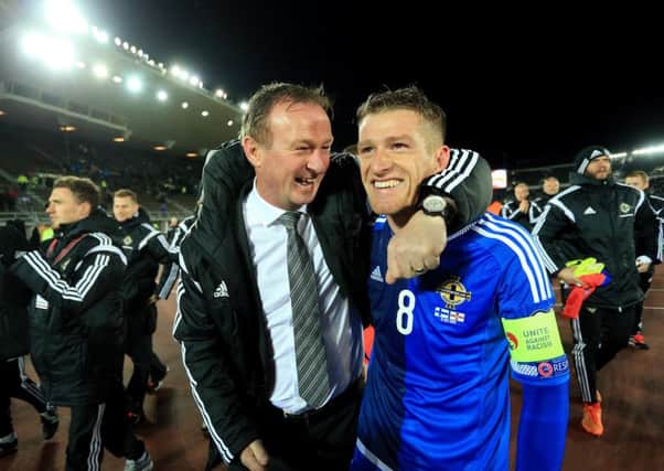 Northern Ireland boss Michael ONeill and captain Steven Davis cant hide their delight at full-time. Picture: Getty Images