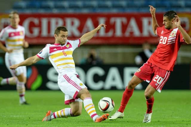 Scotland's Shaun Maloney battles for the ball with Gibraltar's Jean Carlos Garcia (right). Picture: PA
