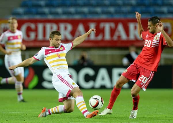 Scotland's Shaun Maloney battles for the ball with Gibraltar's Jean Carlos Garcia (right). Picture: PA
