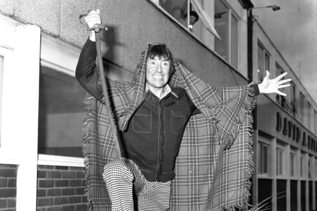 Roy Castle, presenter of the long-running BBC show Record Breakers, before carving the world's largest haggis. Castle died from lung cancer in 1994, having already helped establish the lung cancer charity which carries his name