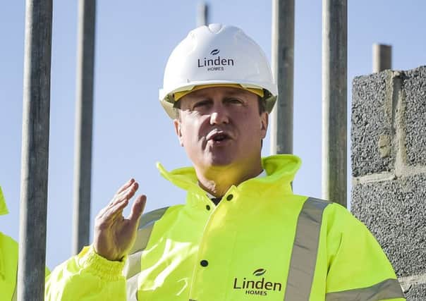 David Cameron on a visit to a new housing project. Picture: PA