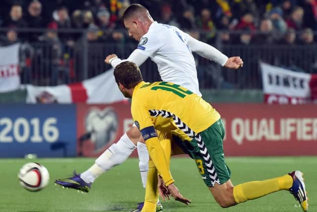 Ross Barkley evades the attention of Lithuanias Mindaugas Panka to score Englands opening goal in their 3-0 victory last night. Picture: Getty