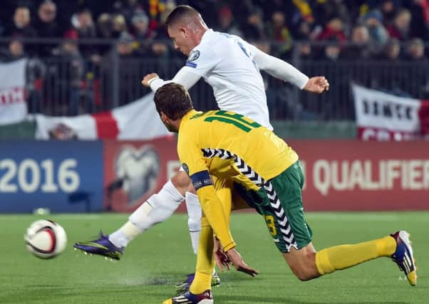 Ross Barkley evades the attention of Lithuanias Mindaugas Panka to score Englands opening goal in their 3-0 victory last night. Picture: Getty