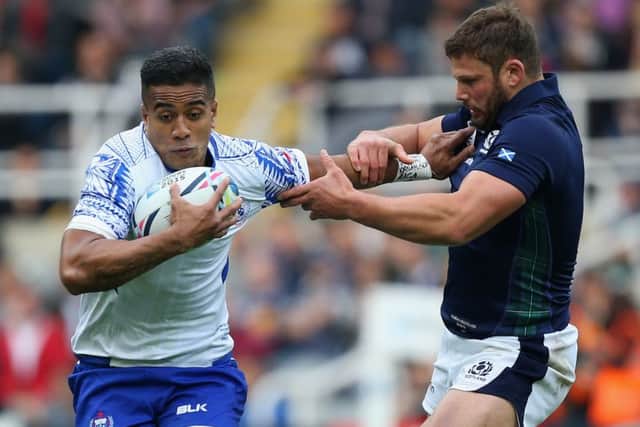 Ross Ford, right, and team-mate Jonny Gray face a sweat over the tackles. Picture: Getty