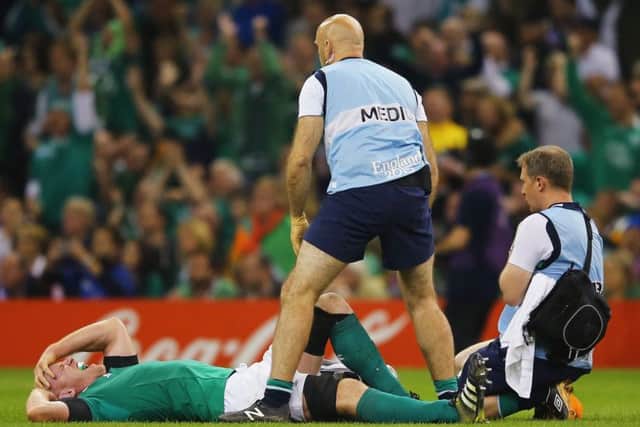 Paul OConnell lies in agony after suffering a torn hamstring injury in Irelands 24-9 victory over the French at Millennium Stadium on Sunday. Picture: Getty