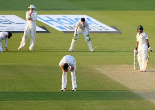 James Anderson holds his head in his hands after seeing Ian Bell drop Mohammad Hafeez at second slip. Hafeez went on to make 98. Picture: Getty