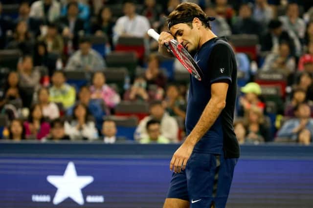Roger Federer shows the strain as he toils during his opening match at the Shanghai Masters, eventually losing in three sets against the Spanish qualifier Albert Ramos-Vinolas. Picture: AP