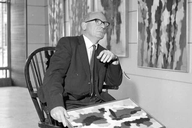 William Gear with some of his paintings. Picture: Contributed
