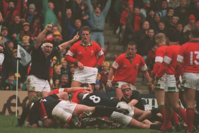 Wright, with his arms raised, celebrates David Hilton's try for Scotland against Wales in March 1995. Picture: Allsport/Getty