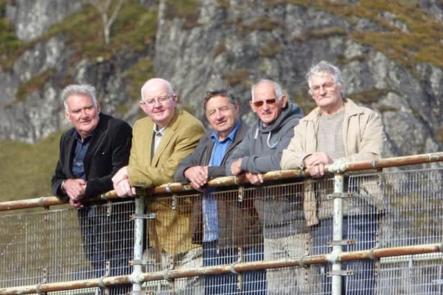 Some of the surviving Tunnel Tigers revisit the site yesterday. Picture: Moira Kerr