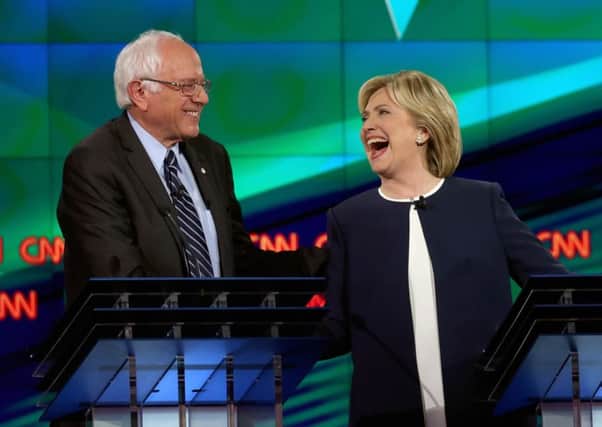 Hillary Clinton shares a joke with Democratic challenger Bernie Sanders, whose bid for the nomination is being likened to Jeremy Corbyns campaign. Picture: getty