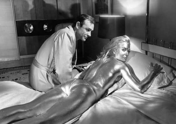 Sean Connery and Shirley Eaton on the set of Goldfinger in 1964