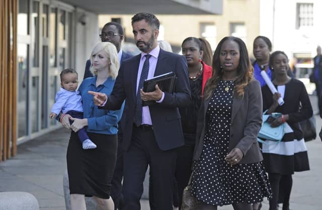The family of Sheku Bayoh with the family's solicitor, Aamer Anwar. Picture:
Neil Hanna