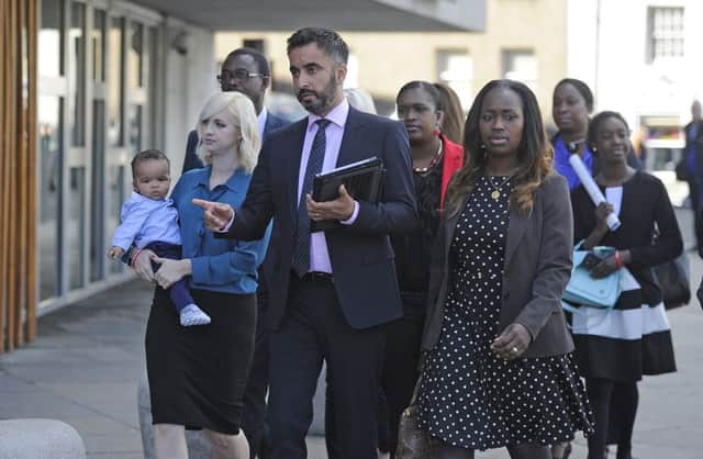 The family of Sheku Bayoh with the family's solicitor, Aamer Anwar. Picture:

 Neil Hanna