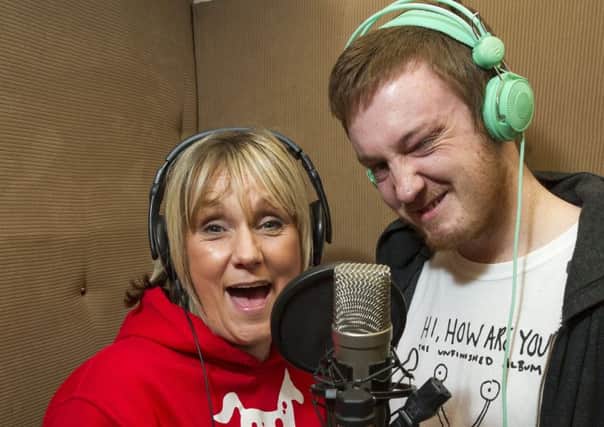 Karen Robertson and rapper Drew Devine. Picture: Ian Rutherford