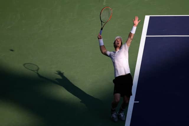 Andy Murray prepares to serve against John Isner. Picture: AP