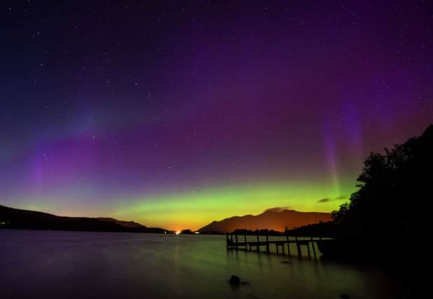 A rare sighting of the Aurora Borealis over Derwentwater, near Keswick in the Lake District. Photographs: Owen Humphreys/PA