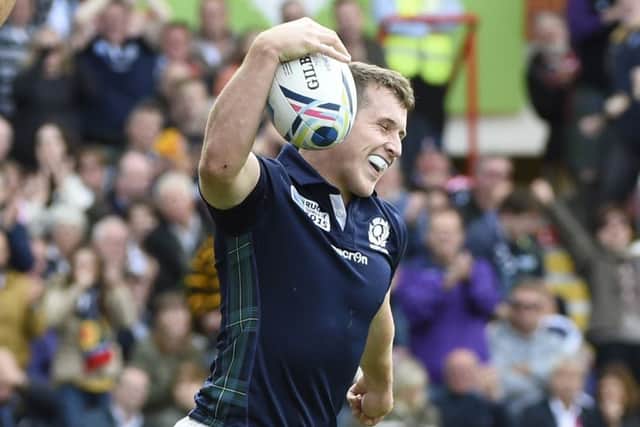 Mark Bennett, pictured after scoring his second try against Japan,  is used to David and Goliath battles. Picture: Getty