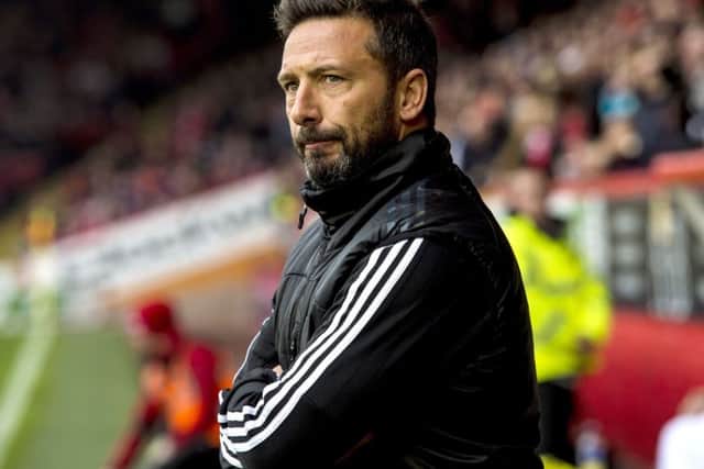 Aberdeens Derek McInnes was yesterday named Ladbrokes Manager of the Month, but was reluctant to pose with his trophy. Picture: SNS