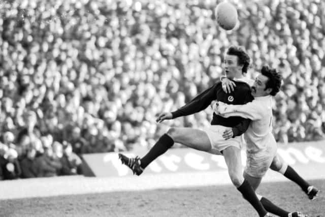 England winger Mike Slemen makes a grab for counterpart Robertson  during Scotlands 7-7 draw at Twickenham in 1979. Picture: Denis Straughan