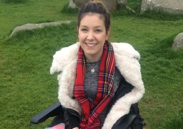 Lucy Lintott, 21, Scotland's youngest MND patient, pictured last year on a  'bucket list' trip to Stonehenge.